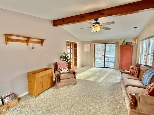 carpeted living room featuring ceiling fan and lofted ceiling with beams