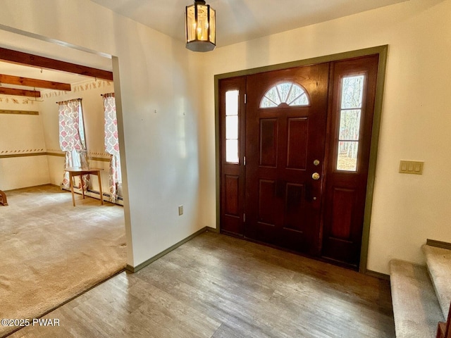 entryway featuring wood-type flooring and beam ceiling