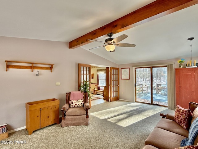 living room featuring ceiling fan, plenty of natural light, carpet floors, and vaulted ceiling with beams