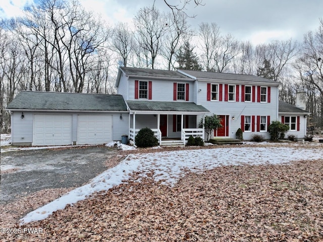 view of front of property featuring a porch and a garage