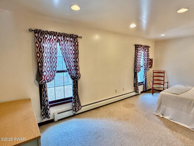 bedroom with carpet and baseboard heating