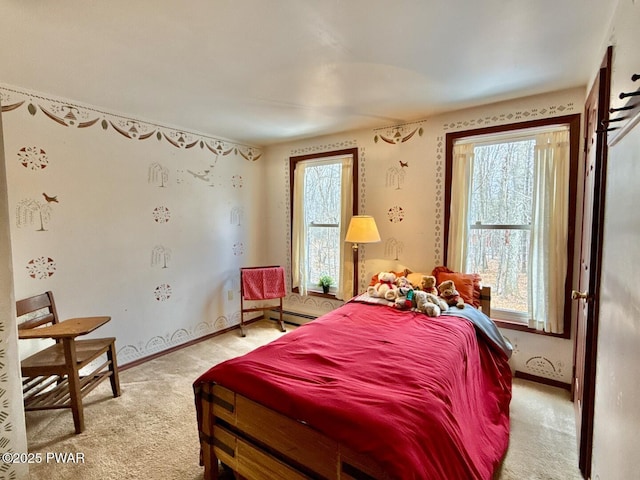 carpeted bedroom featuring a baseboard radiator