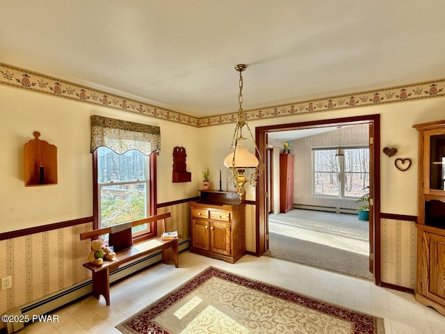 sitting room featuring a baseboard heating unit