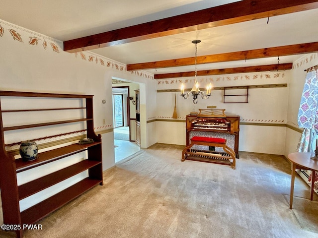 interior space with beam ceiling and a chandelier