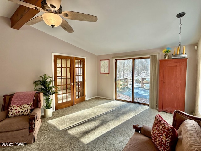 living room featuring lofted ceiling with beams, carpet flooring, ceiling fan, and french doors