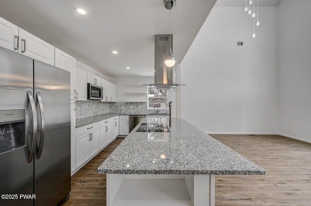 kitchen with appliances with stainless steel finishes, open shelves, dark wood-style flooring, island range hood, and decorative backsplash