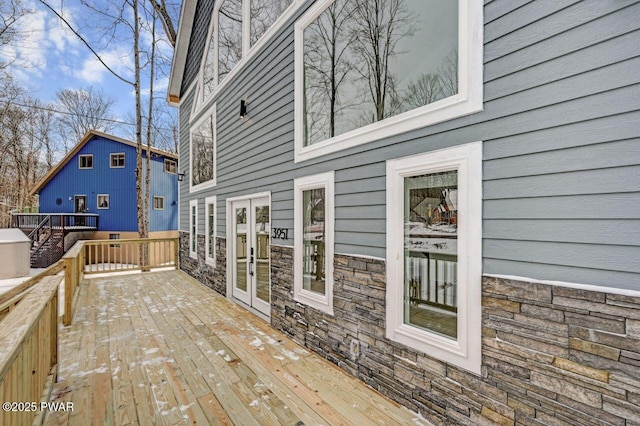 wooden deck featuring french doors