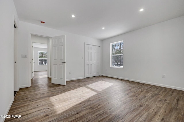 unfurnished bedroom featuring hardwood / wood-style floors