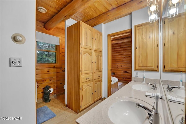 210 Fawn Lake Dr, Hawley, PA 18428 - full bath with double vanity, wood finished floors, and a wood ceiling with exposed beams