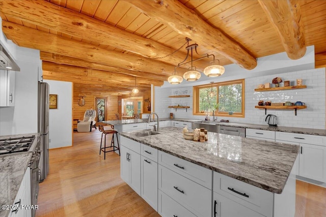 210 Fawn Lake Dr, Hawley, PA 18428 - kitchen featuring light wood-style flooring, a wood ceiling with exposed beams, white cabinetry, tasteful backsplash, and light stone countertops