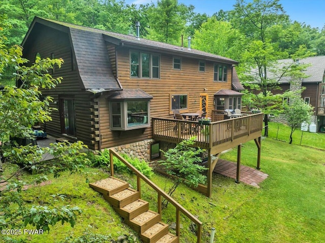 210 Fawn Lake Dr, Hawley, PA 18428 - back of house with a shingled roof, a wooden deck, a lawn, log siding, and a gambrel roof
