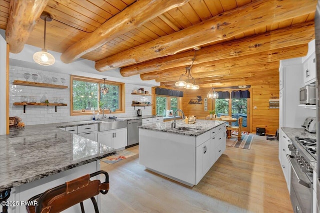 210 Fawn Lake Dr, Hawley, PA 18428 - kitchen featuring open shelves, appliances with stainless steel finishes, a wood ceiling with exposed beams, light wood-style floors, and healthy amount of natural light