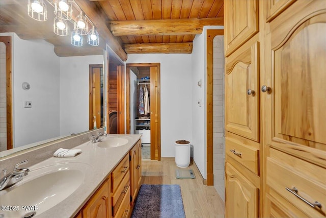 210 Fawn Lake Dr, Hawley, PA 18428 - bathroom featuring wood finished floors, double vanity, and a wooden ceiling with exposed beams