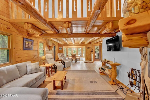 210 Fawn Lake Dr, Hawley, PA 18428 - living room featuring light wood finished floors, beamed ceiling, and wood walls