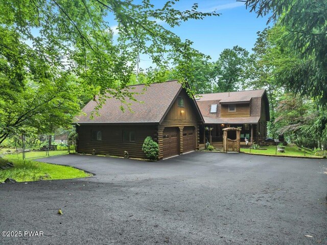 210 Fawn Lake Dr, Hawley, PA 18428 - log home with log siding, a porch, and a shingled roof
