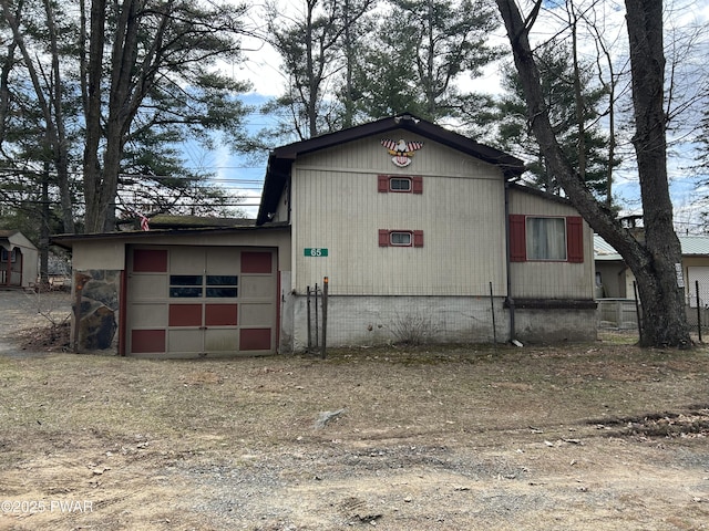 65 Cone Ln, Hawley, PA 18428 - exterior space featuring an attached garage