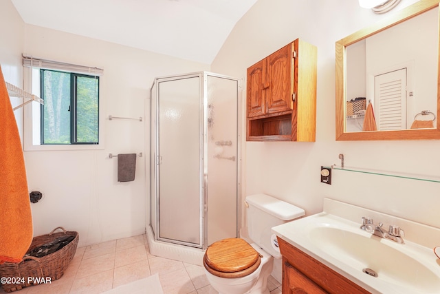 bathroom featuring vanity, vaulted ceiling, a shower with door, tile patterned flooring, and toilet