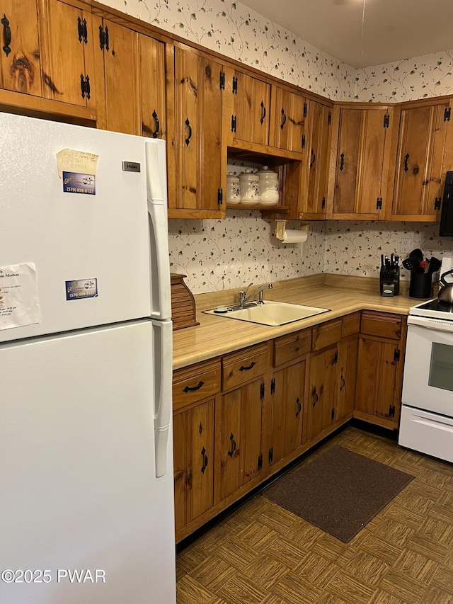 259 Florence Trl, Hawley, PA 18428 - kitchen with white appliances, light countertops, and brown cabinetry