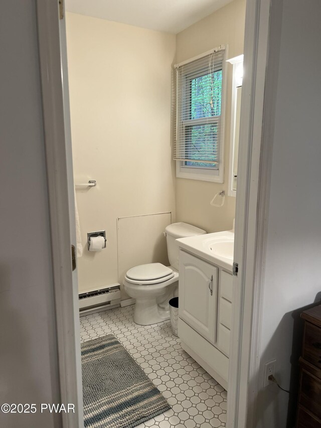 259 Florence Trl, Hawley, PA 18428 - half bathroom featuring a baseboard heating unit and vanity