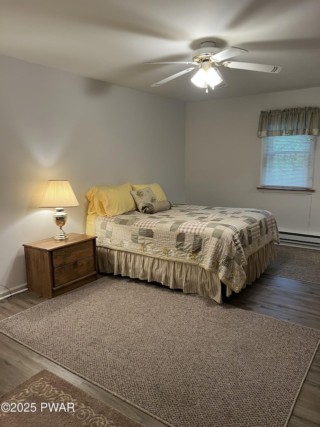 259 Florence Trl, Hawley, PA 18428 - bedroom featuring a baseboard heating unit, wood finished floors, and ceiling fan