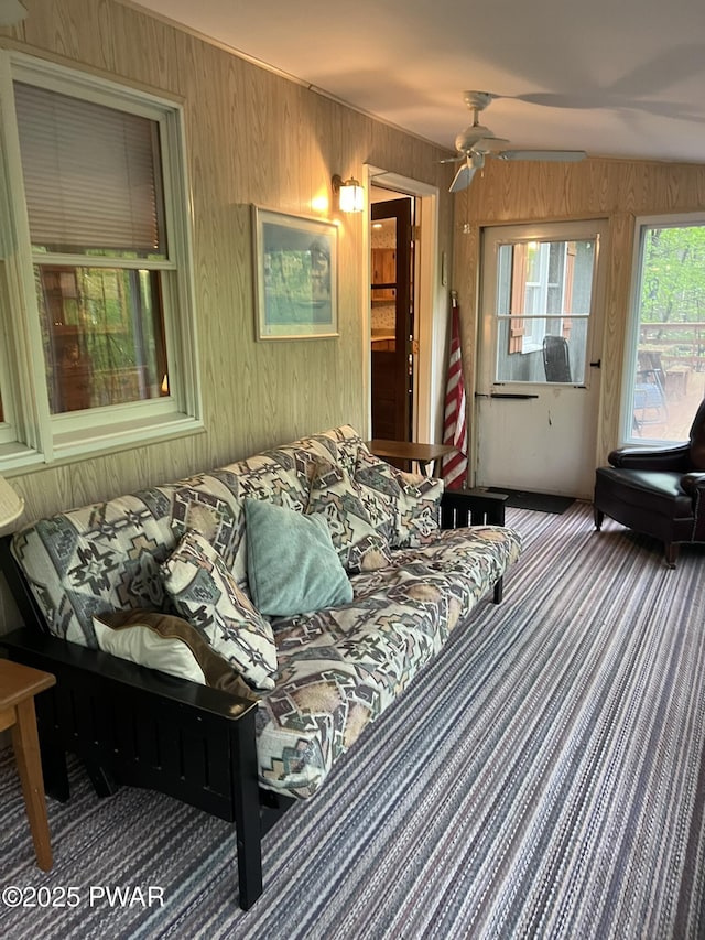 259 Florence Trl, Hawley, PA 18428 - living area featuring wood walls, carpet, and ceiling fan