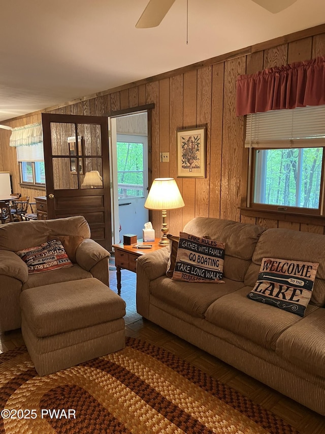 259 Florence Trl, Hawley, PA 18428 - living area with wooden walls and a ceiling fan