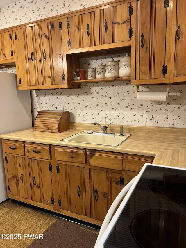 259 Florence Trl, Hawley, PA 18428 - kitchen featuring brown cabinetry, light countertops, open shelves, and fridge