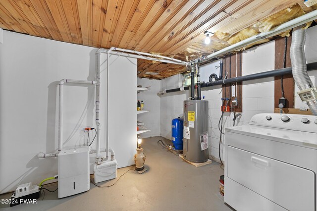 basement featuring electric water heater, washer / clothes dryer, and wooden ceiling