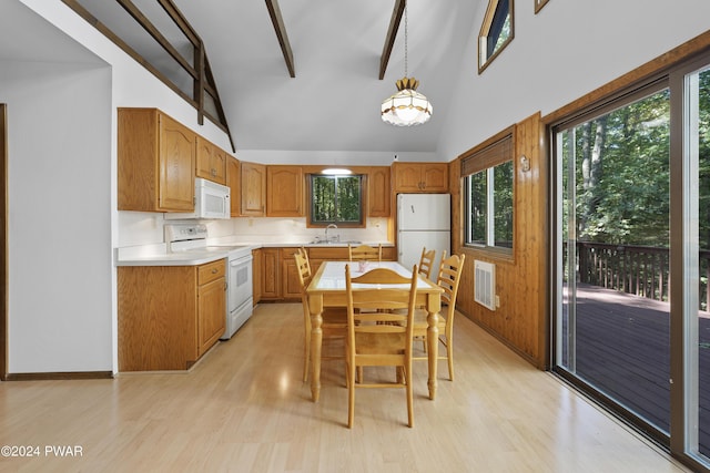 kitchen with white appliances, sink, pendant lighting, high vaulted ceiling, and beamed ceiling