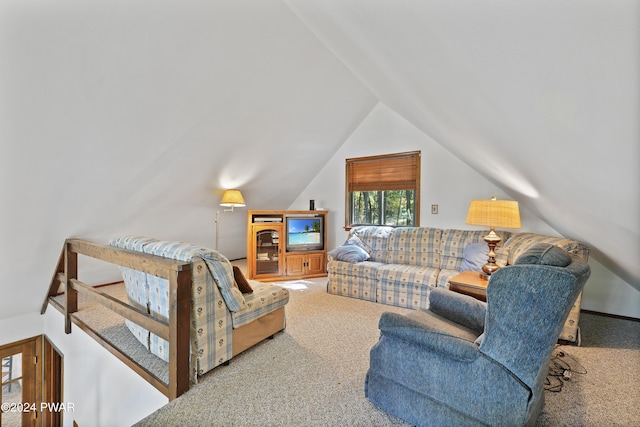 living room with carpet and vaulted ceiling