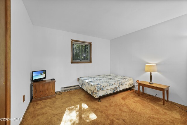 carpeted bedroom featuring a baseboard radiator