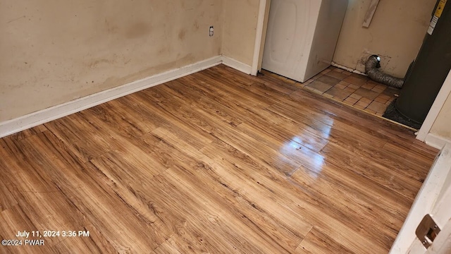 unfurnished bedroom with light wood-type flooring