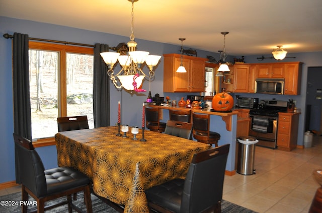 123 Fern Dr, Canadensis, PA 18325 - dining room featuring light tile patterned flooring and a chandelier