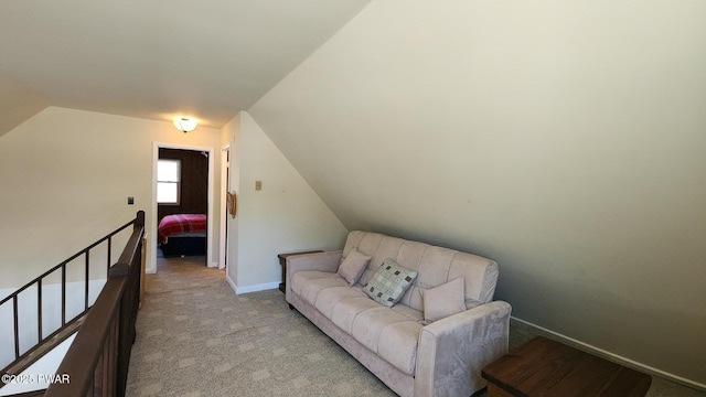 213 Powderhorn Dr, Lackawaxen, PA 18435 - sitting room with an upstairs landing, lofted ceiling, light colored carpet, and baseboards