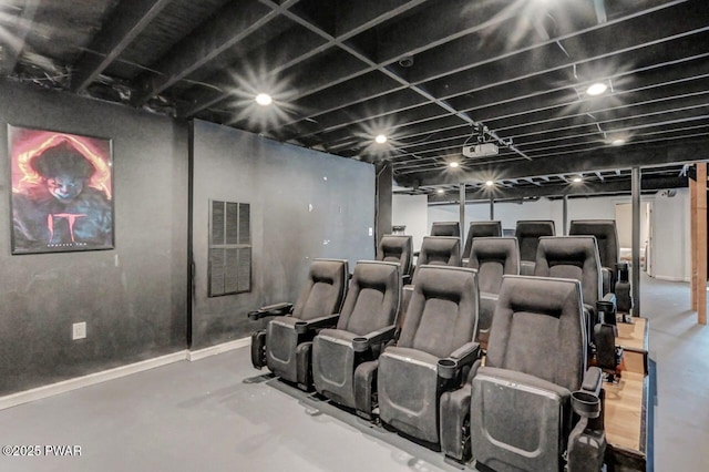 home theater room with concrete flooring