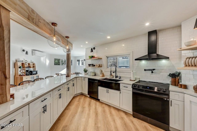 kitchen featuring white cabinetry, range with electric cooktop, dishwasher, and wall chimney range hood