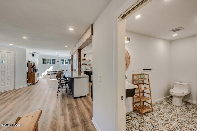 corridor featuring light hardwood / wood-style flooring