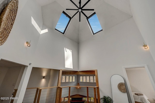 details with a skylight and ceiling fan