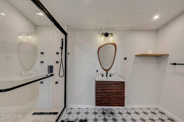 bathroom with vanity and a shower with shower door