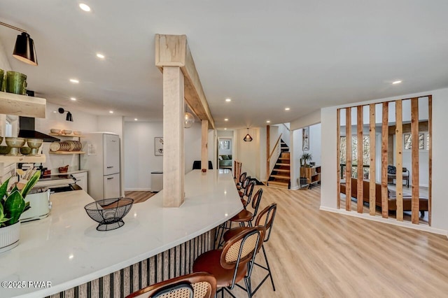 dining area with light hardwood / wood-style flooring