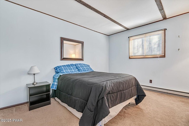 carpeted bedroom with a baseboard heating unit