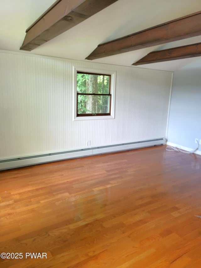 108 Juniper St, Dingmans Ferry, PA 18328 - empty room with beam ceiling, wood finished floors, and a baseboard heating unit