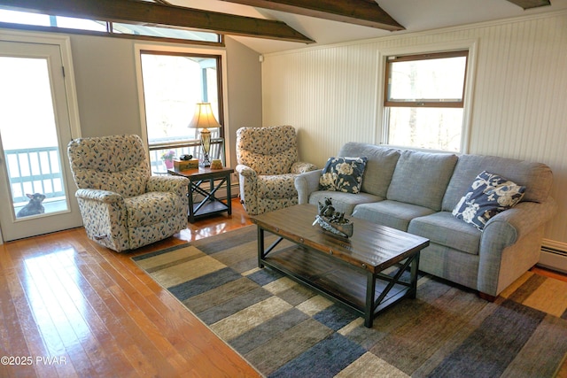 108 Juniper St, Dingmans Ferry, PA 18328 - living area featuring healthy amount of natural light, wood finished floors, and a baseboard radiator