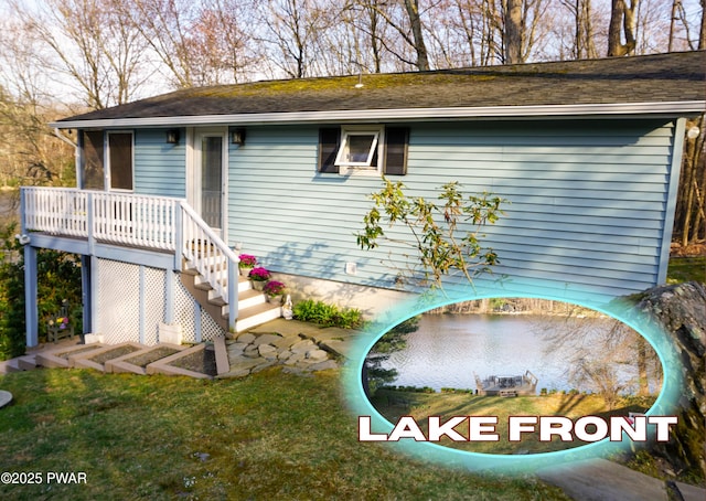 108 Juniper St, Dingmans Ferry, PA 18328 - view of front facade featuring roof with shingles, a front lawn, and a deck