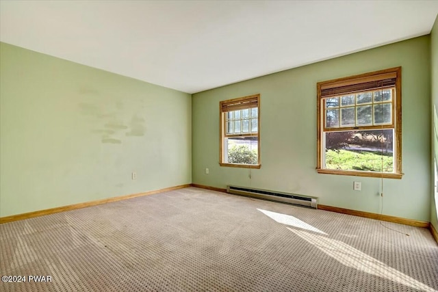 empty room with light carpet and a baseboard radiator