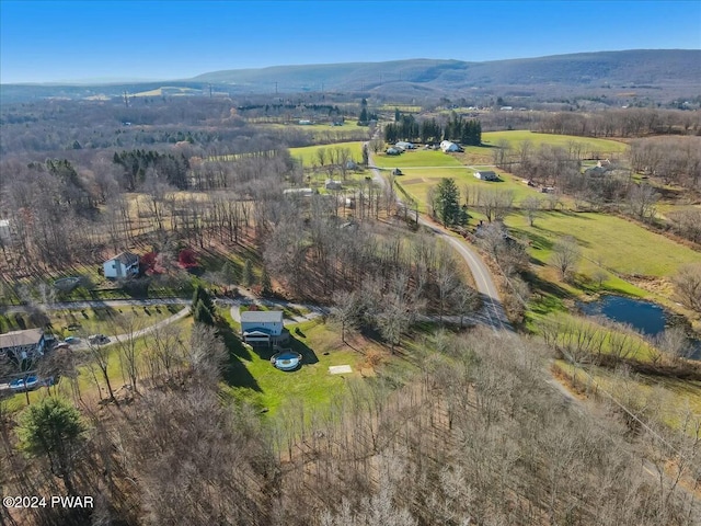 aerial view featuring a rural view and a water and mountain view