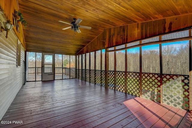 unfurnished sunroom featuring vaulted ceiling, ceiling fan, and wooden ceiling