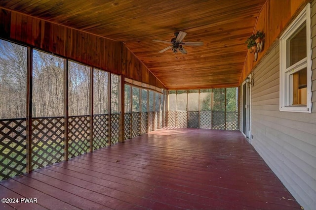 unfurnished sunroom with ceiling fan, lofted ceiling, and wood ceiling