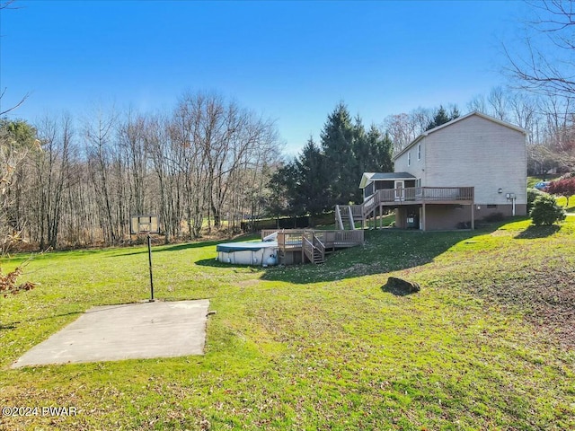 view of yard with a patio area and a pool side deck