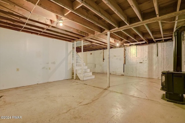 basement featuring a wood stove